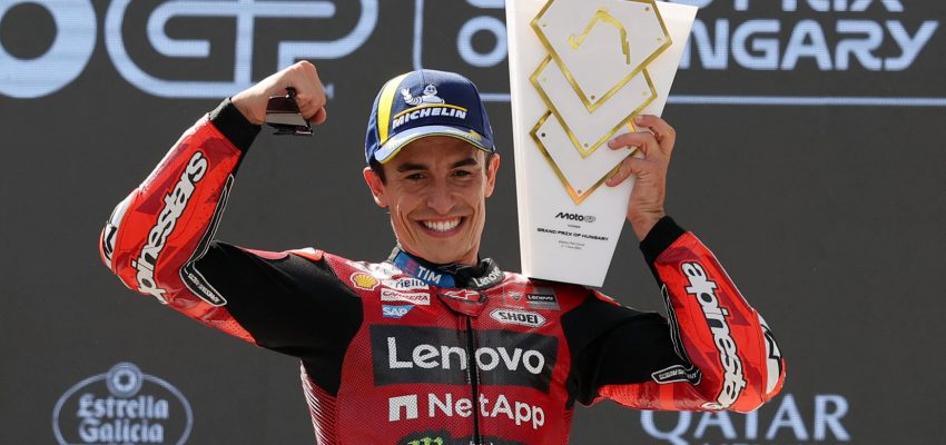 MotoGP - Hungarian Grand Prix - Balaton Park Circuit, Balatonfokajart, Hungary - June 7, 2026 Ducati Lenovo Team's Marc Marquez celebrates on the podium with a trophy after winning his 100th MotoGP race REUTERS/Bernadett Szabo