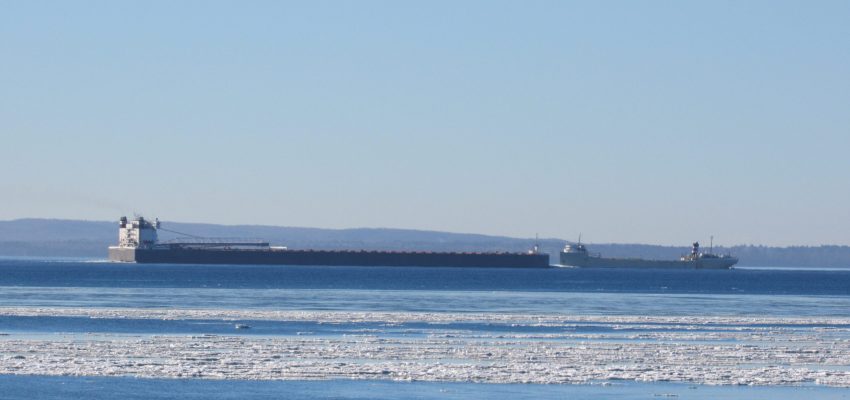 The historic 519-foot SS “Alpena” is dwarfed by the 1,000-foot MV “American Century” as the two ships meet at the Straits of Mackinac on a cold winter morning December 18, 2018. (Erich T. Doerr/St. Ignace News)