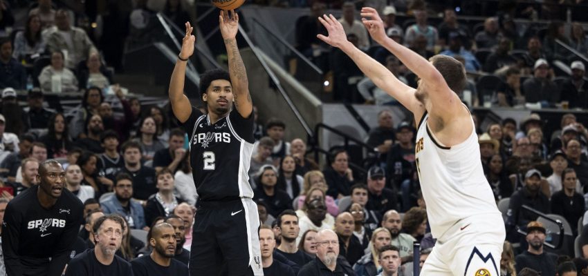 San Antonio Spurs guard Dylan Harper (2) shoots the ball at Frost Bank Center in San Antonio on Thursday, March 12, 2026.
