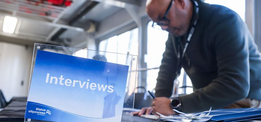 "Interviews" signage during a job fair hosted by Statue City Cruises at Liberty Landing Marina in Jersey City, New Jersey, US, on Tuesday, March 17, 2026. The US Department of Labor is scheduled to release initial jobless claims figures on March 19. Photographer: Michael Nagle/Bloomberg via Getty Images