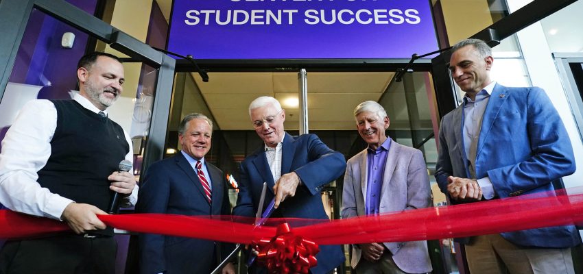 Tom Lewis (center), along with, from left, Mark Petroff, CCOB Dean John Kaites, University President Brian Mueller and TW Lewis Foundation Executive Director Steve Smith, cut the ceremonial ribbon during the official opening of the TW Lewis Center for Student Success at the Colangelo College of Business on Oct. 22, 2025.